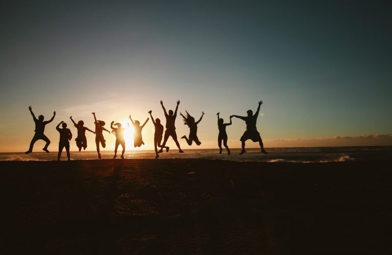 silhouette-photography-of-group-of-people-jumping-during-1000445